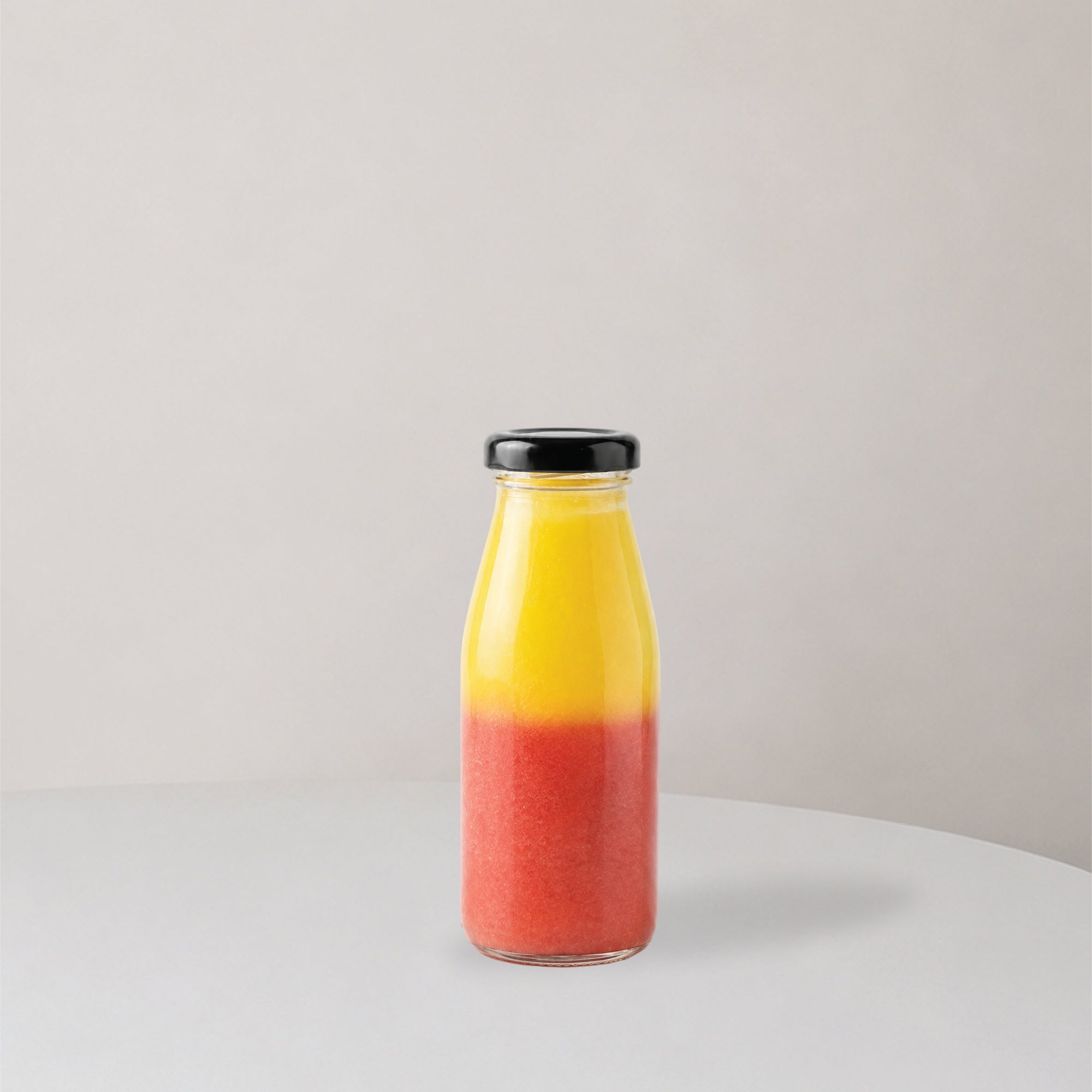 Glass bottle with two layer juice